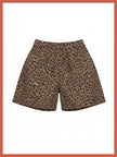 A pair of leopard print shorts in brown and black, displayed flat against a white background with a coral border.